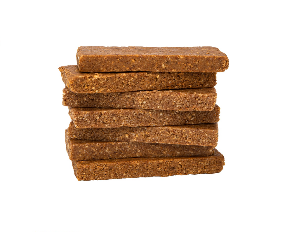 Image of 7 stacked 1.75 oz unwrapped Coconut Cashew Whole Food Energy Bars