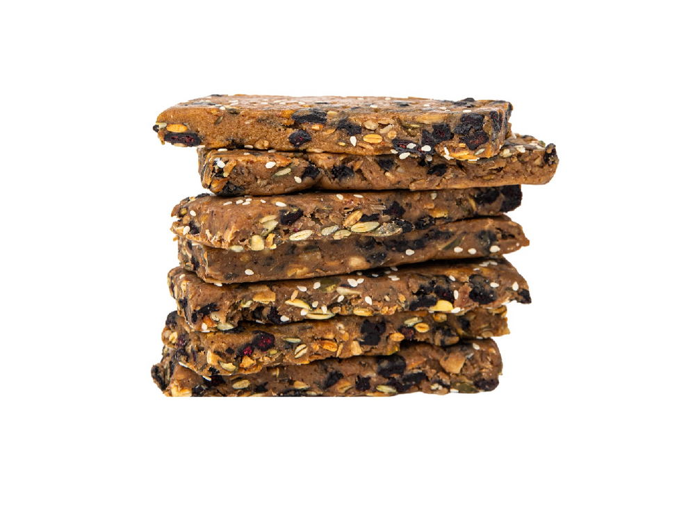 Blueberry Lemon Whole Food Energy Bars stacked together unwrapped with ingredients visible